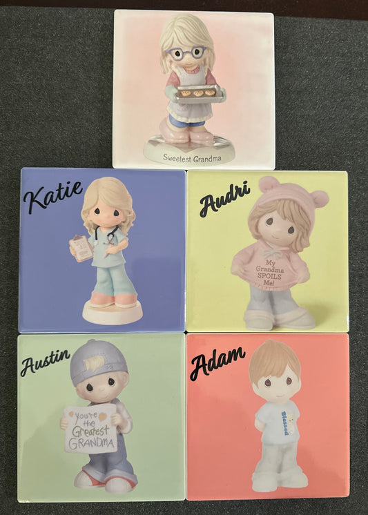Set of small figurines with personalized names on a dark surface