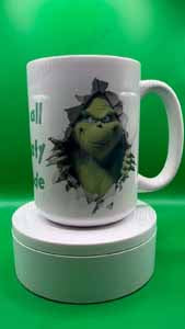 4-inch ceramic custom coaster with cork backing, shown beneath a mug on a green background.