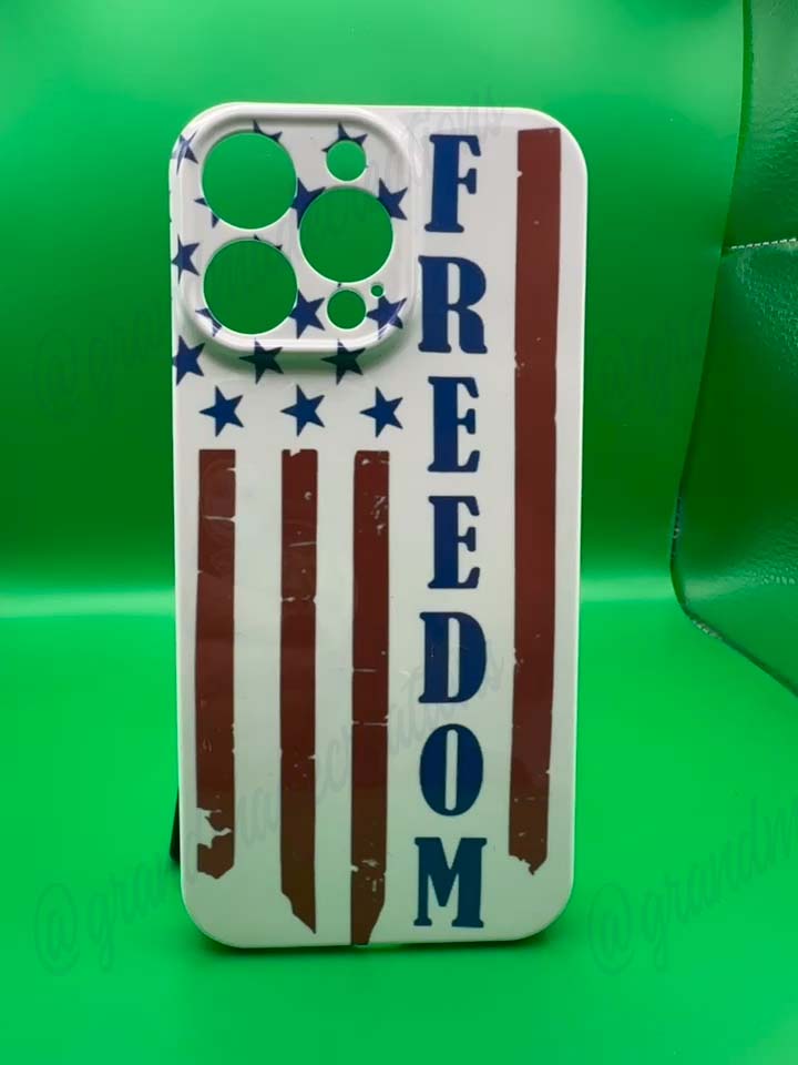 Phone case with 'FREEDOM' text and American flag design on a green background